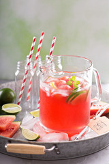 Watermelon drink with lime in a pitcher
