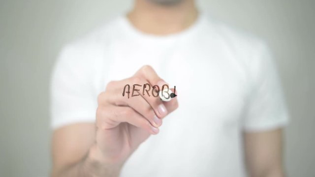 Aerobics, man writing on transparent screen