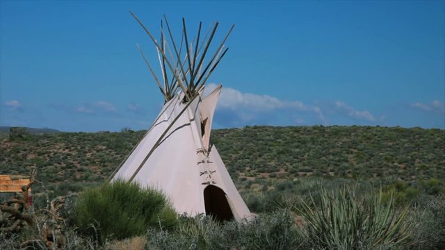 A gentle breeze provides the only movement in this scene with an American Indian teepee.