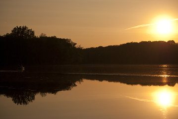 Fototapeta na wymiar Watching the sunset on the lake