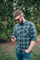 Fototapeta premium Man with gadget and glasses
