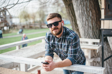 Man with gadget and glasses