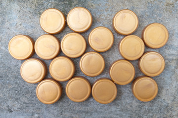 Obraz na płótnie Canvas Recycled gold plastic bottle caps