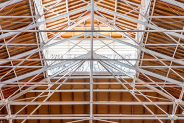 Wooden ceiling with skylight and iron beam structure