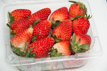  fresh strawberries in a plastic box