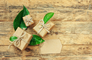 Three gift box with green leaves