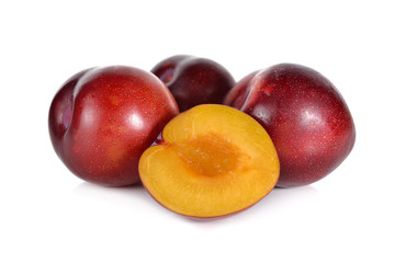ripe ruby plum fruit on white background