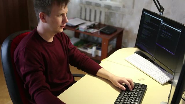 Programmer working on the computer. Edit program code