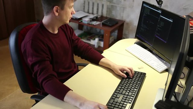 Programmer working on the computer. Edit program code