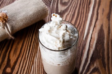 Latte coffee in cup with spices.
