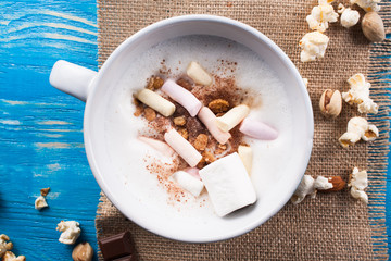 Latte coffee in cup with spices.