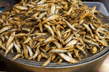 Broiled anchovy, fried fish. Street food