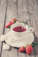 Fruit tea with strawberries. Toned photo