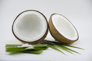 Coconut isolated on coconut leave on white background