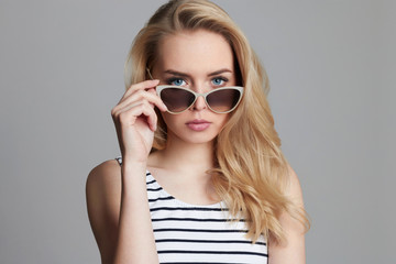 Beautiful blond girl in sunglasses
