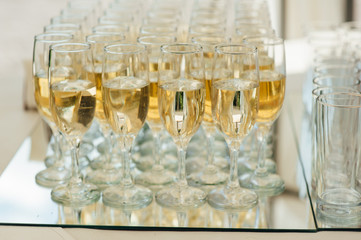 Wedding glasses filled with champagne at banquet