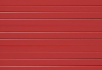 Red garage door. Texture background.