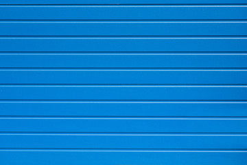 Blue garage door. Texture background.