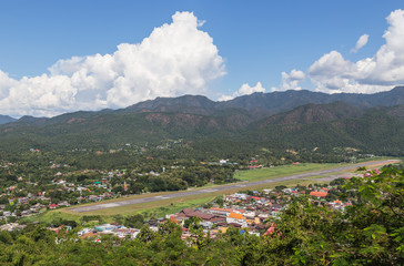Fototapeta premium High angle view of mae hong son city and runway mae hong son airport in Thailand.