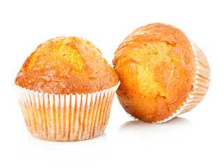 Delicious muffins close-up isolated on white background.