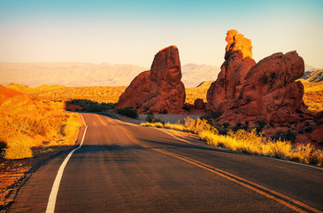 Red sunset over road at Valley of Fire State Park, southern Nevada, USA