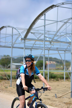happy woman riding mountain bike