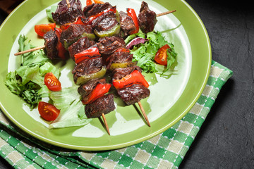 Grilled beef meat and vegetable kebabs
