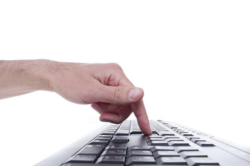 Finger on computer keyboard