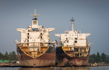 Two partially broken down ocean ships at a shipbreaking yard in Chittagong, Bangladesh
