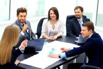 manager discussing work with his colleagues