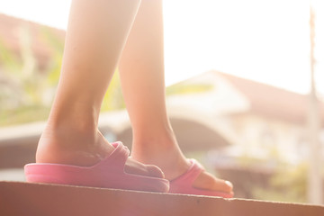 Little girl walk on the wall, vintage tone.