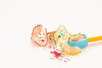 Pencil crayon and sharpener on white background.