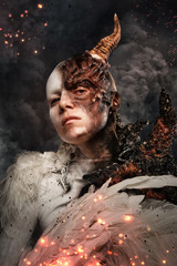 Portrait of devil woman with horn.