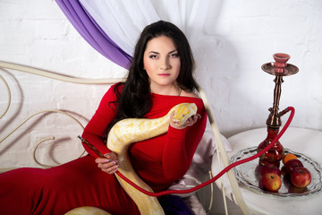 Beautiful sexy girl holding a white albino python