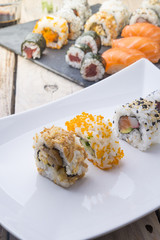 Salmon and caviar rolls served on a plate