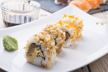Salmon and caviar rolls served on a plate