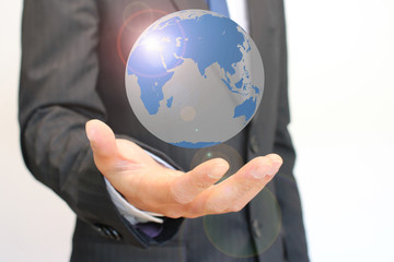 地球を手にするビジネスマン Globe on a hand of a businessman