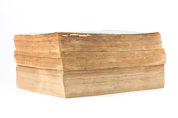 Pile of old books on white background.