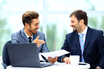 Business men discussing together in an office