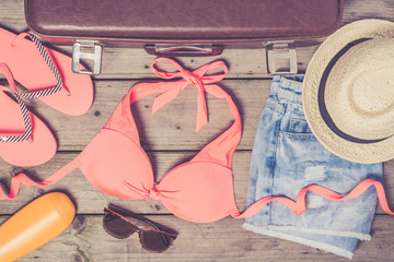 Beach accessories on wooden background