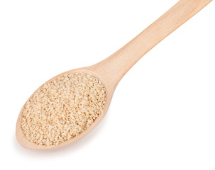 sesame seeds in spoon isolated on white background