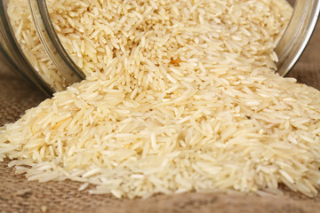 Rice hessian glass jar / Pile of rice on hessian with a glass jar