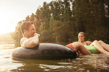 Couple relaxing in water on a summer day.