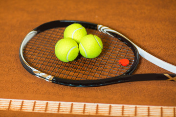 Tennis Balls on a Racket Close Up