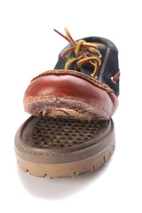 torn shoe on a white background isolate.