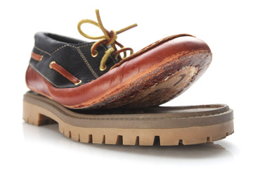 torn shoe on a white background isolate.