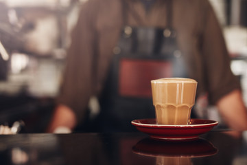 Coffee cup with saucer on cafe counter