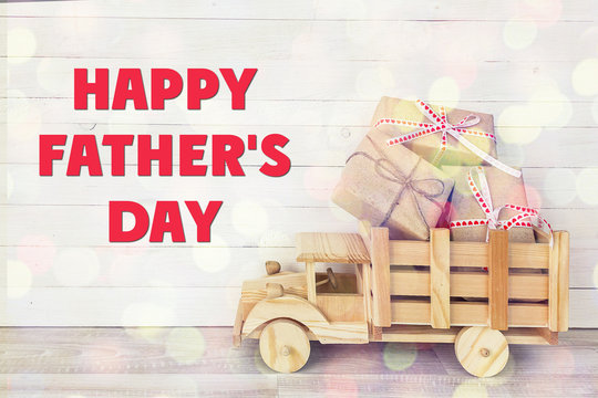 Fathers day background with toy truck with gift boxes in the bac - Powered by Adobe