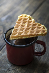 heart shaped waffles and coffee on table