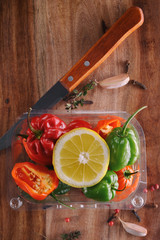 still life. painting vegetables.fresh peppers of different colors on a wooden board. burning spices. Background of fresh vegetables. view from above. flat lay.